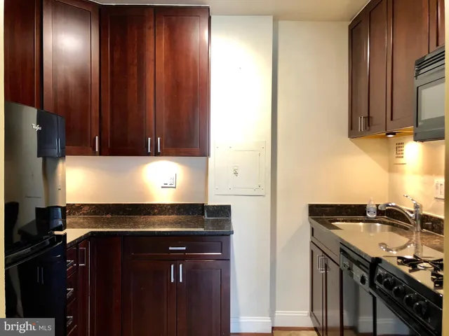 a close view of sink and cabinets