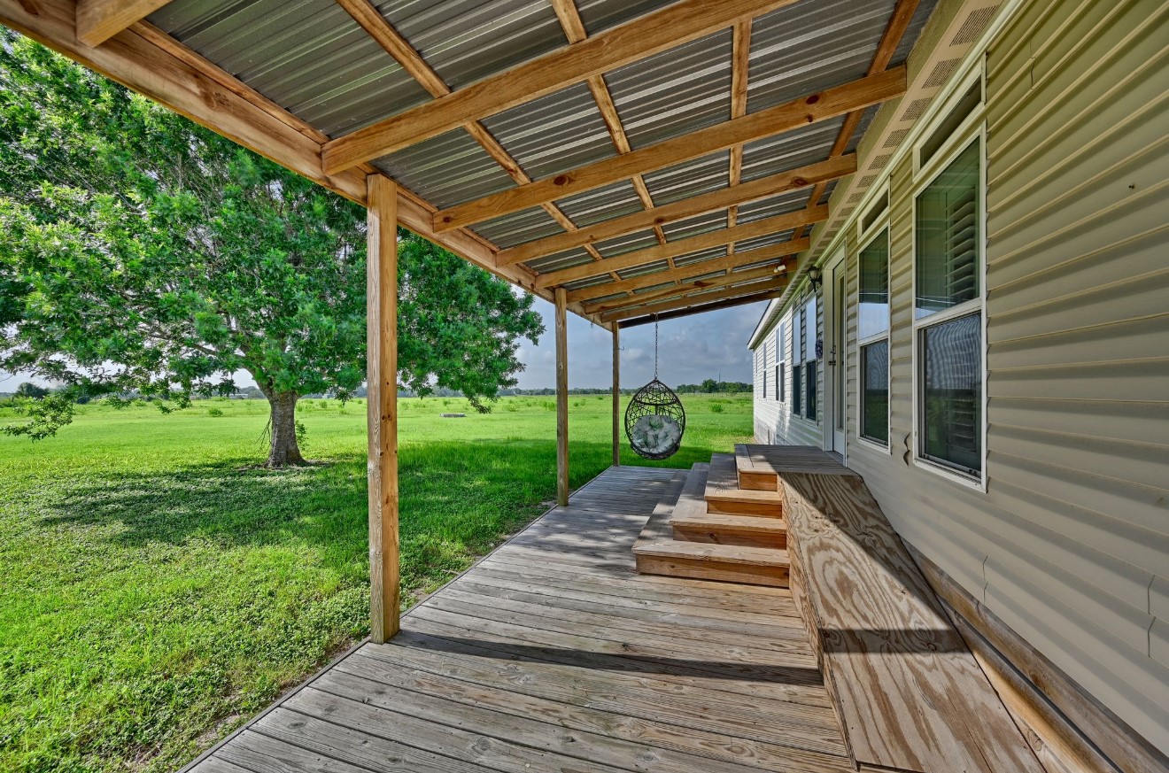 10901 Harmon School Road Burton, TX 77835 - Photo 16 of 23 a front view of a house with a yard
