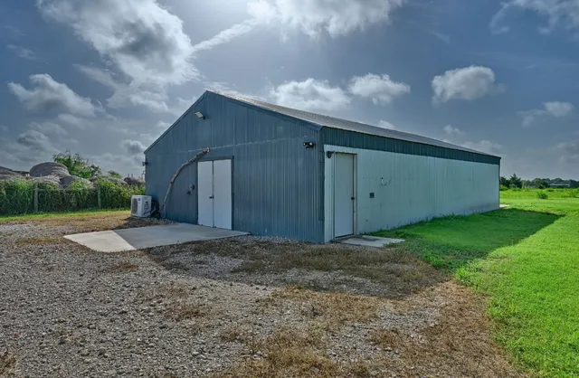 a view of an house with backyard space and garden