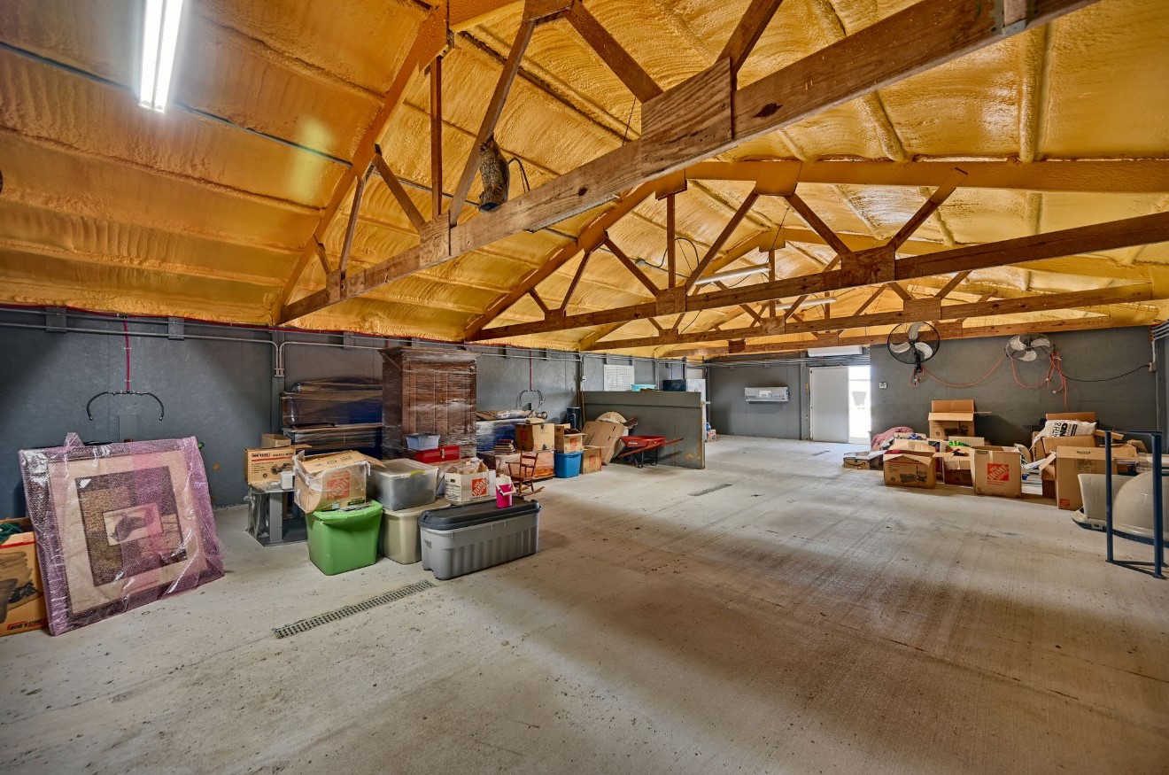10901 Harmon School Road Burton, TX 77835 - Photo 19 of 23 a view of a garage with stuff