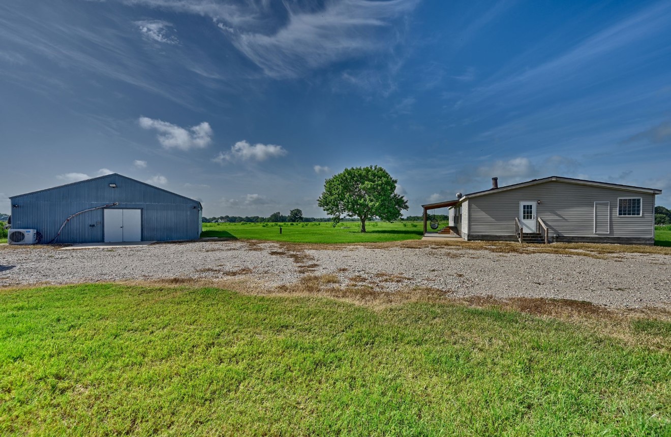 10901 Harmon School Road Burton, TX 77835 - Photo 20 of 23 a house view with a backyard space