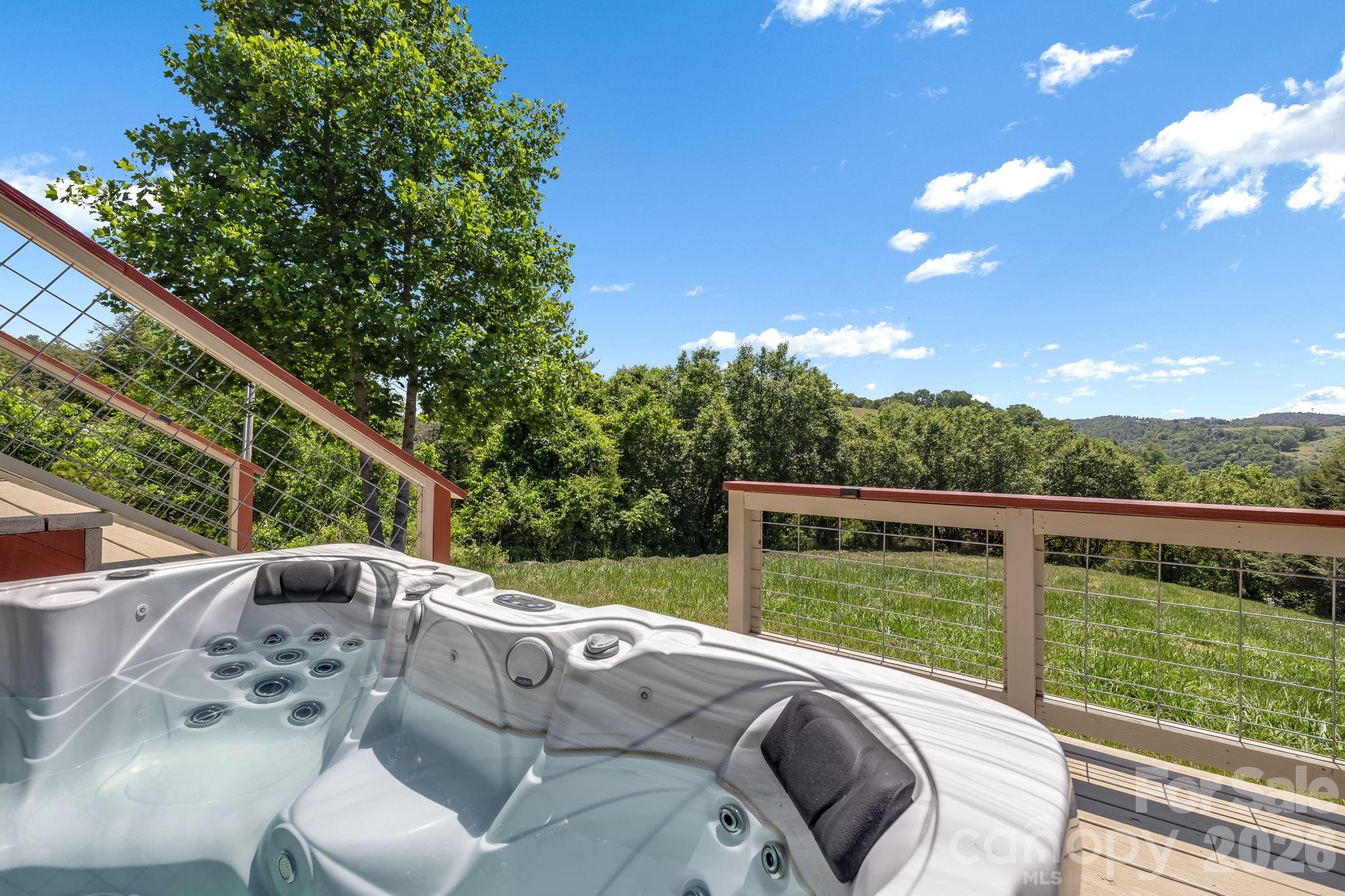 694 Boulder Road Marshall, NC 28753 - Photo 3 of 44 a view of balcony with furniture and garden