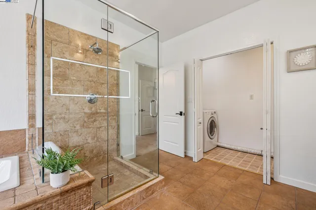a bathroom with a shower and a mirror