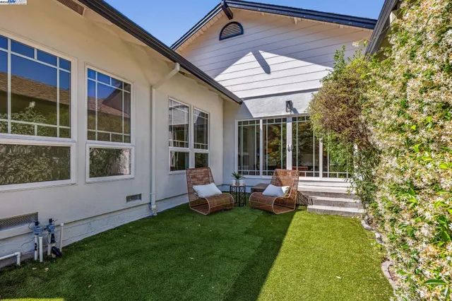 a front view of a house with a garden and porch