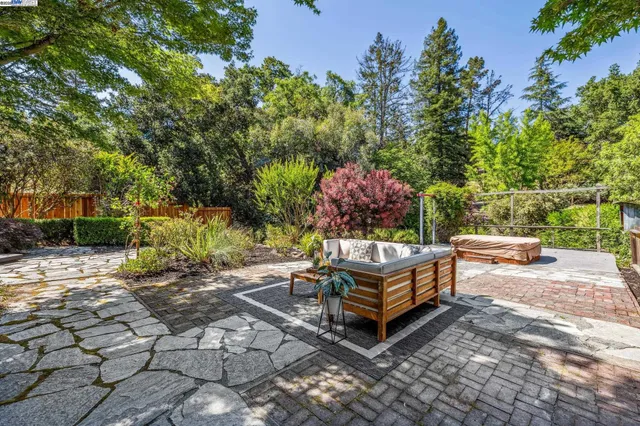 a view of a backyard with sitting area
