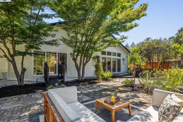 a front view of a house with garden