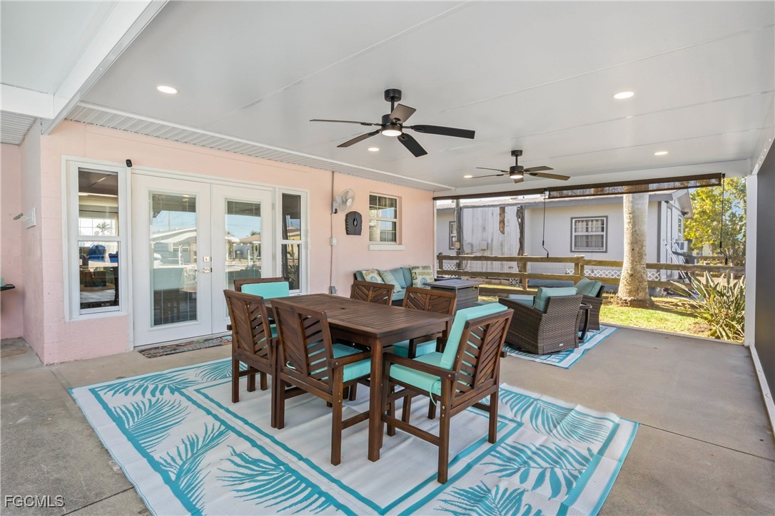 2556 Cay Cove Matlacha, FL 33993 - Photo 24 of 44 a view of a dining room with furniture window and wooden floor