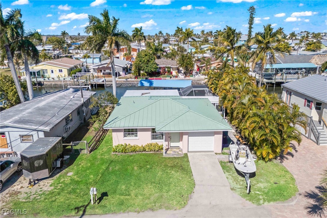 2556 Cay Cove Matlacha, FL 33993 - Photo 3 of 44 a aerial view of a house with garden space and street view