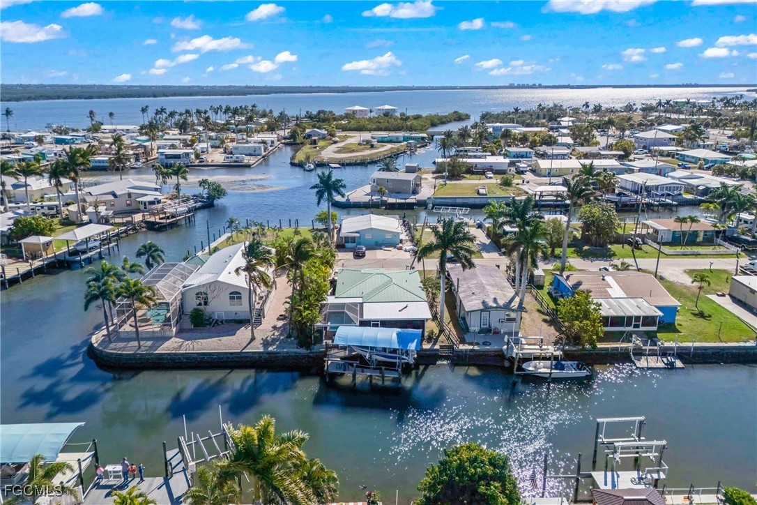 2556 Cay Cove Matlacha, FL 33993 - Photo 42 of 44 an aerial view of a house with a lake view