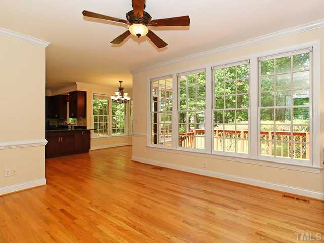 4820 Salem Ridge Road Holly Springs, NC 27540 - Photo 5 of 12 The family room is open to the kitchen and overlooks the large deck and private back yard Den/Family/Great Room