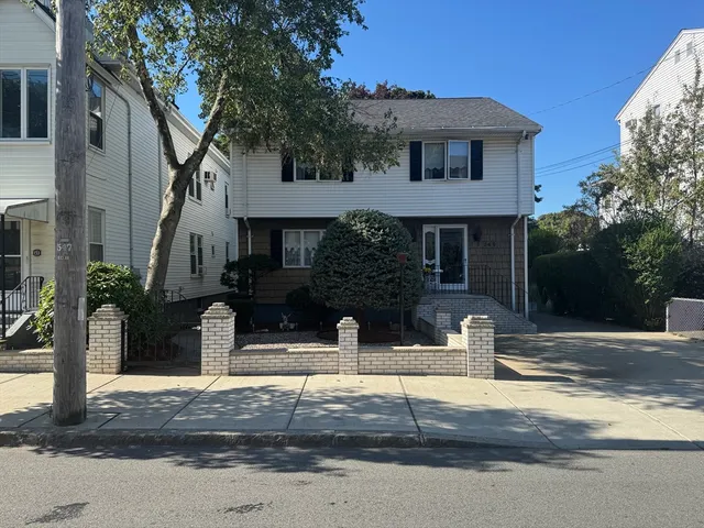 a front view of a house with street