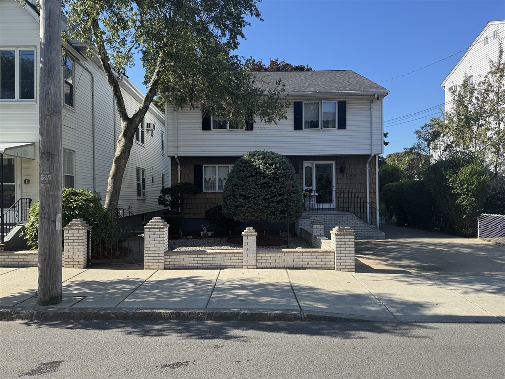 a front view of a house with street