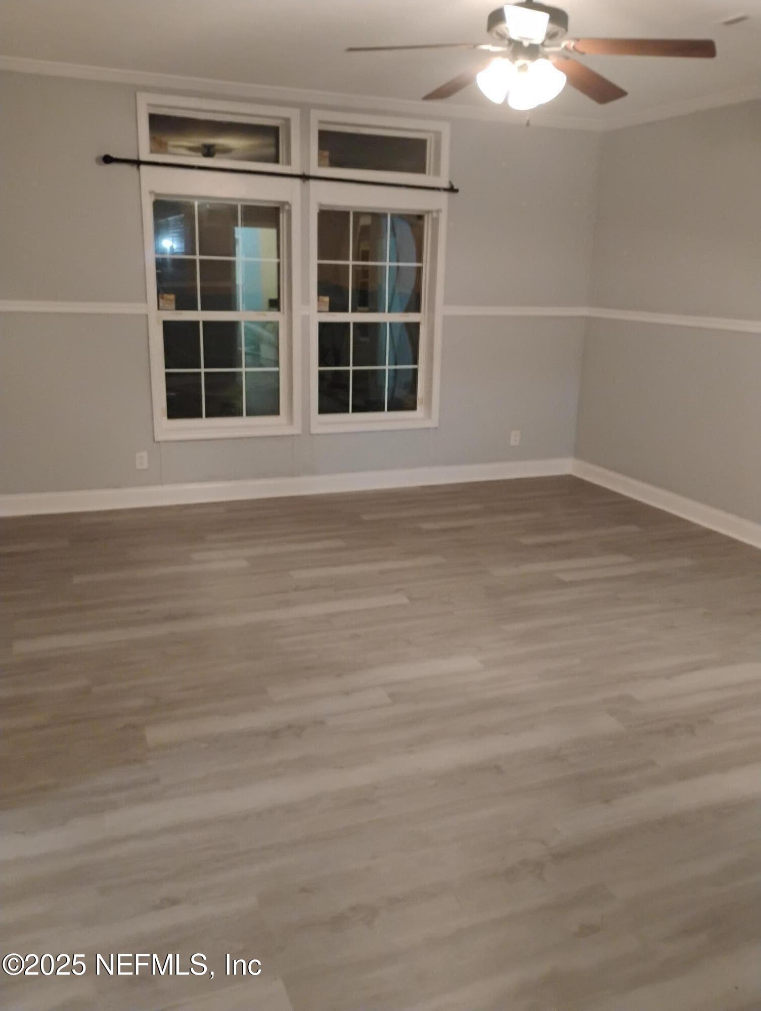 598 San Mateo Road San Mateo, FL 32187 - Photo 3 of 12 a view of empty room with windows