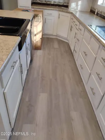 a hallway with cabinets