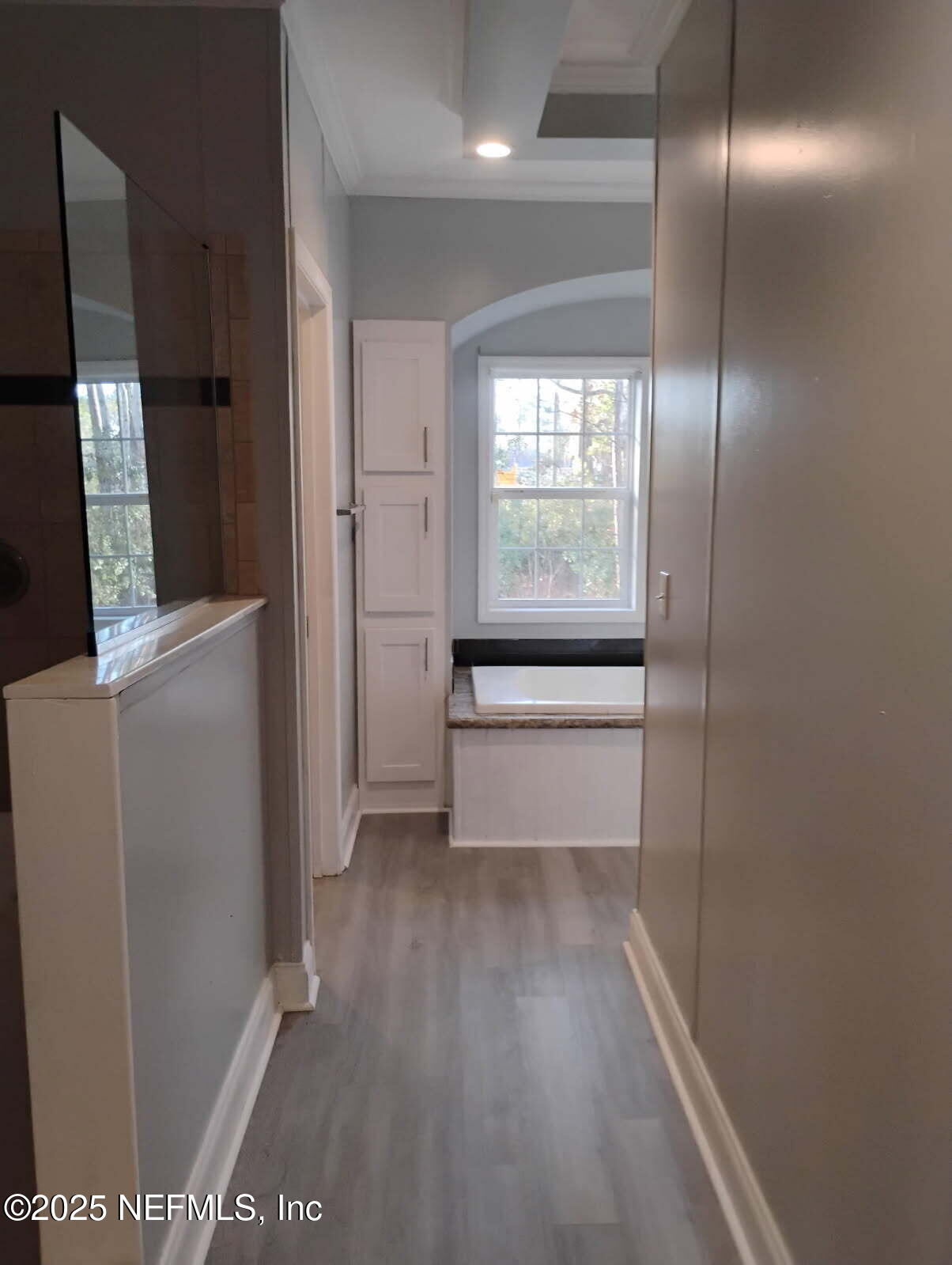 598 San Mateo Road San Mateo, FL 32187 - Photo 10 of 14 a view of a hallway with wooden floor