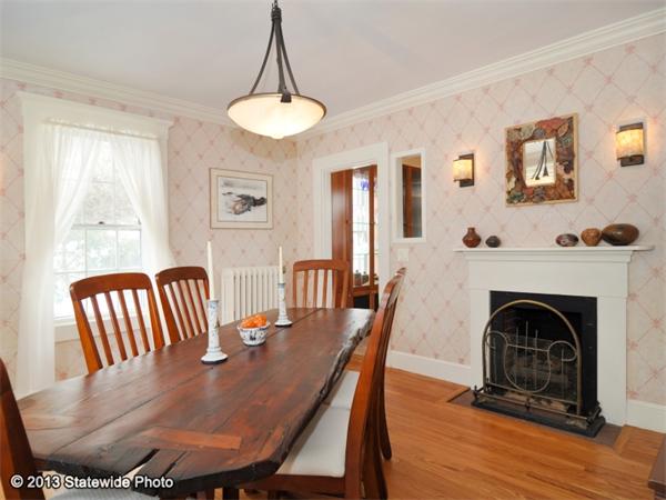 452 Highland Road Tiverton, RI 02878 - Photo 12 of 26 a view of a dining room with furniture wooden floor and chandelier