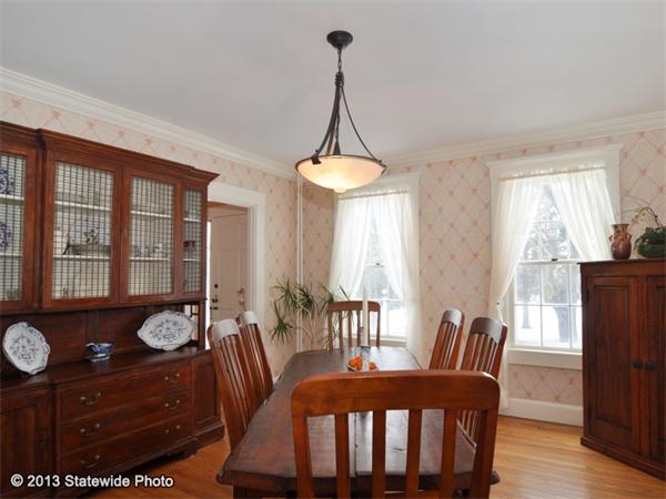 452 Highland Road Tiverton, RI 02878 - Photo 14 of 26 a dining room with furniture window and wooden floor
