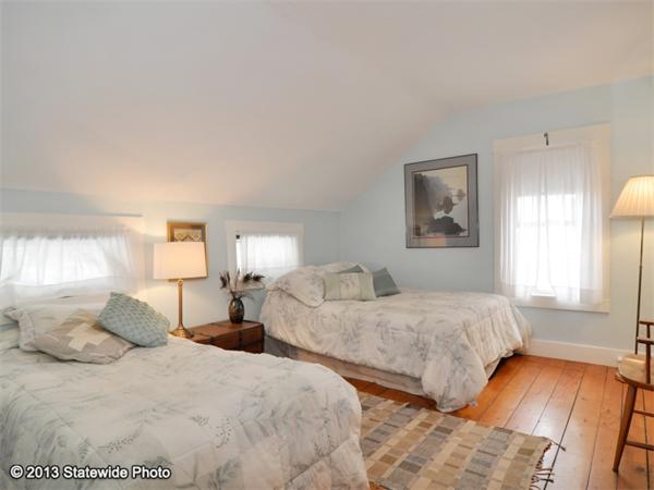 452 Highland Road Tiverton, RI 02878 - Photo 16 of 26 a bedroom with two beds and painting on the wall