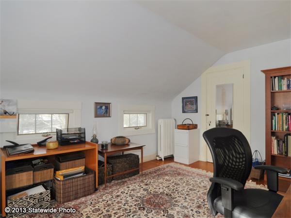 452 Highland Road Tiverton, RI 02878 - Photo 19 of 26 a livingroom with workspace and a couch