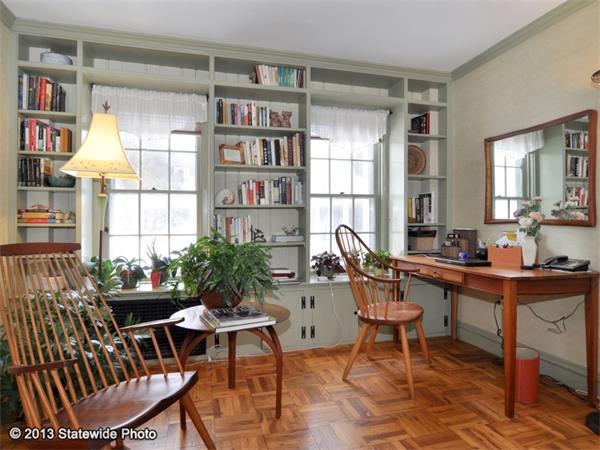 452 Highland Road Tiverton, RI 02878 - Photo 4 of 26 a view of a workspace with furniture and a potted plant