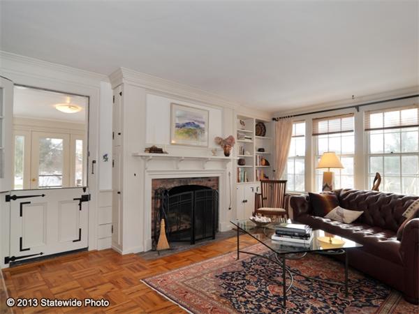 452 Highland Road Tiverton, RI 02878 - Photo 5 of 26 a living room with furniture a fireplace and a table