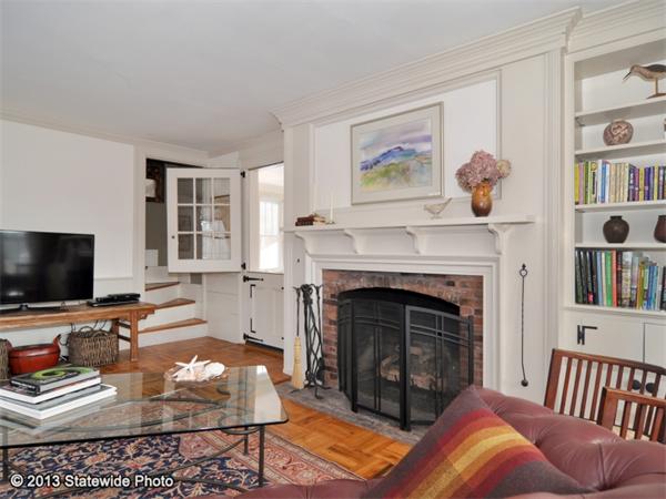 452 Highland Road Tiverton, RI 02878 - Photo 6 of 26 a living room with furniture and a fireplace