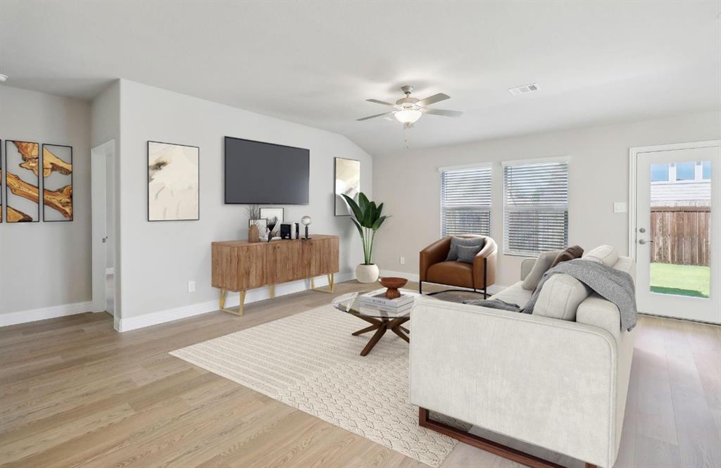 503 Stagg Street McKinney, TX 75069 - Photo 11 of 19 a living room with furniture and a flat screen tv