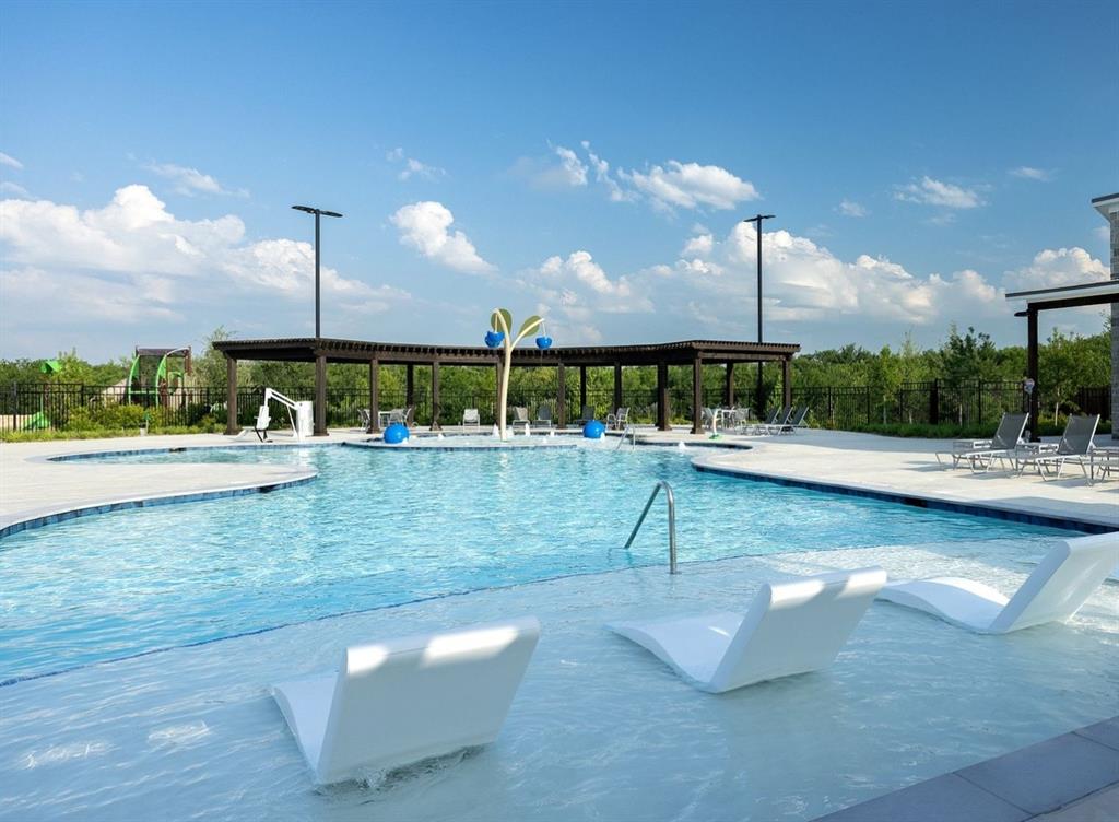 503 Stagg Street McKinney, TX 75069 - Photo 12 of 19 a view of a swimming pool with a lawn chairs