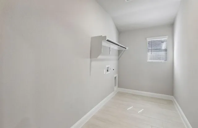 an empty room with a bathroom