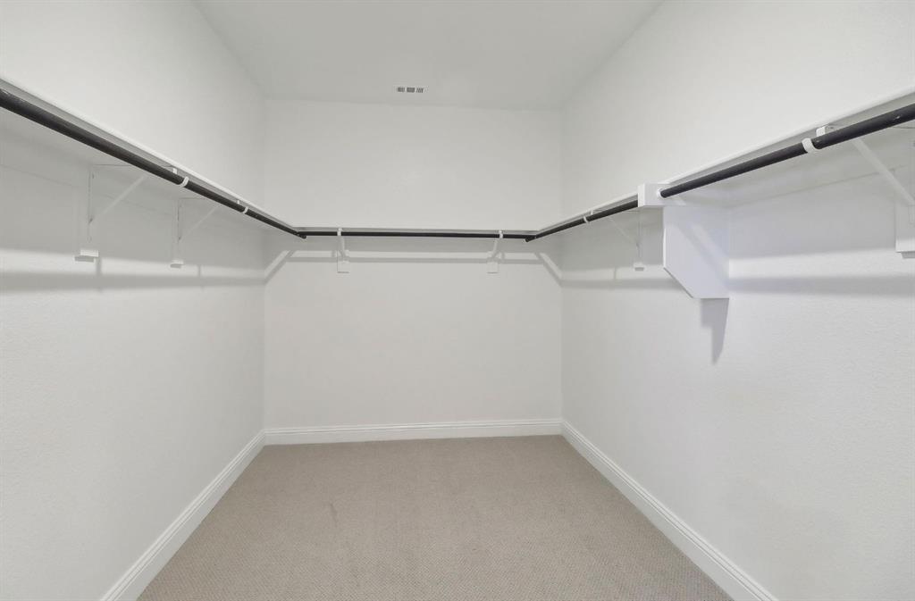 503 Stagg Street McKinney, TX 75069 - Photo 19 of 19 a view of a room with racks on the wall