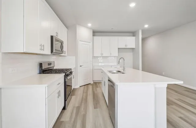 a view of a dining room with furniture and window
