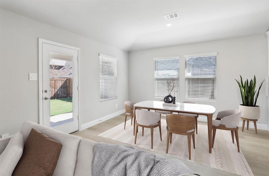 503 Stagg Street McKinney, TX 75069 - Photo 9 of 19 a view of a dining room with furniture and window
