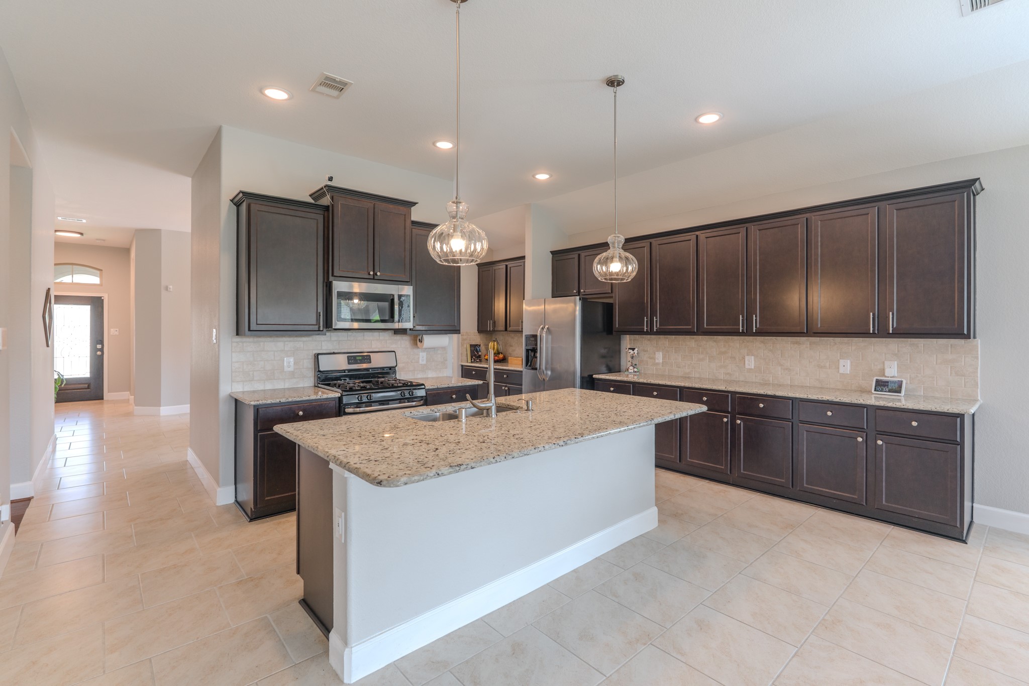 24322 North Newcastle Bay Trail Spring, TX 77389 - Photo 15 of 50 a large kitchen with kitchen island a sink stainless steel appliances and cabinets