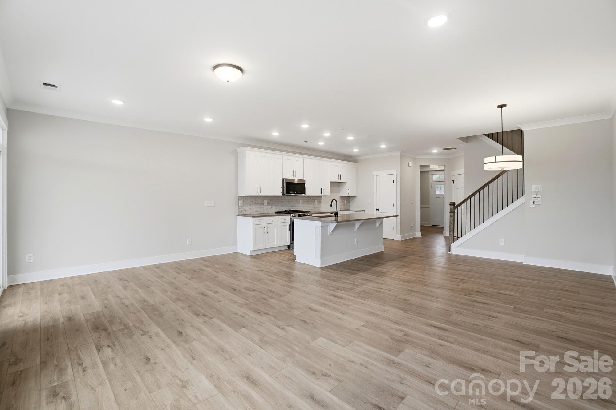 410 Limelight Road Waxhaw, NC 28173 - Photo 11 of 27 a view of kitchen with wooden floor