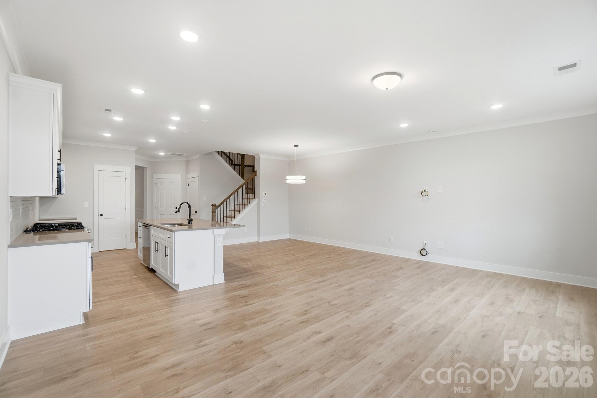410 Limelight Road Waxhaw, NC 28173 - Photo 12 of 27 a view of kitchen with cabinets and wooden floor