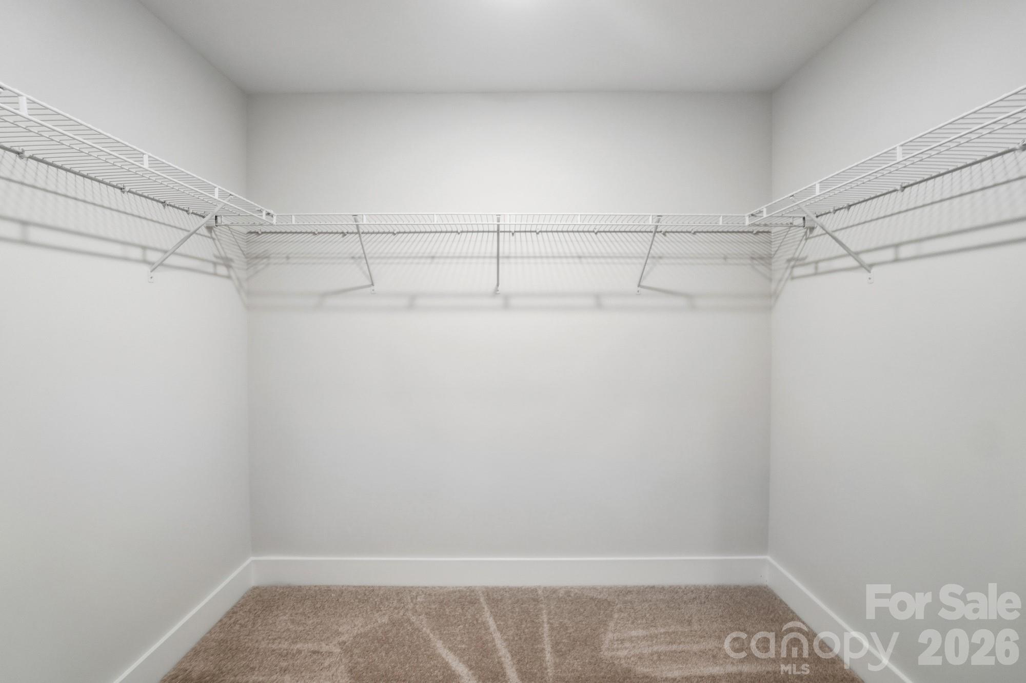 410 Limelight Road Waxhaw, NC 28173 - Photo 19 of 27 a view of a room with racks on the wall