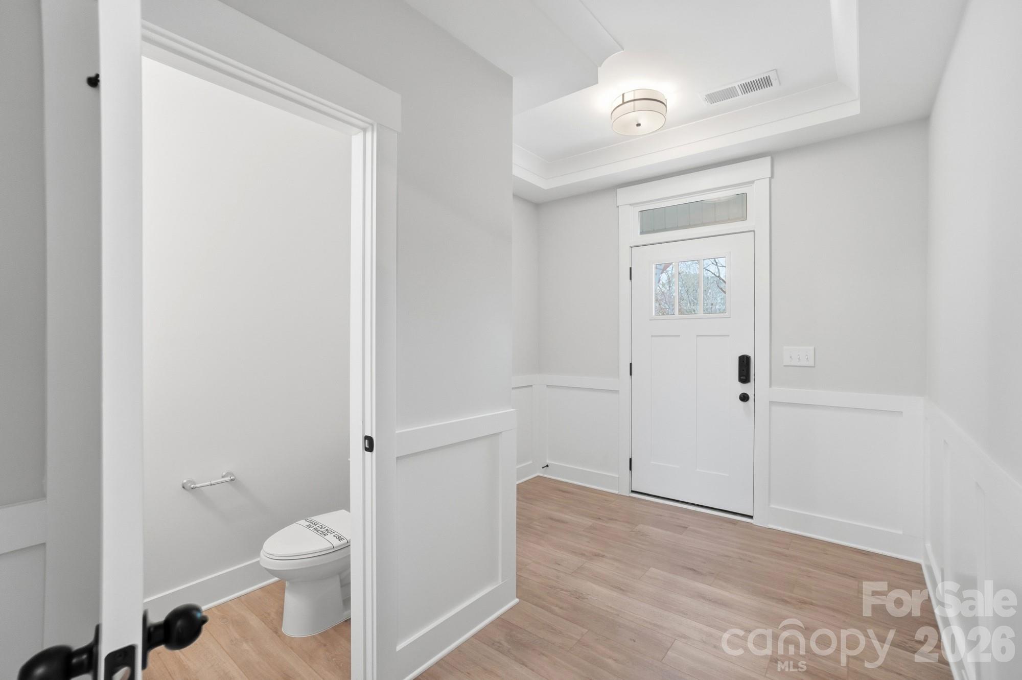 410 Limelight Road Waxhaw, NC 28173 - Photo 3 of 27 a bathroom with a toilet and a shower