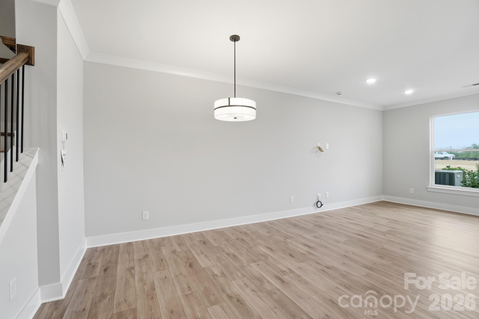 410 Limelight Road Waxhaw, NC 28173 - Photo 9 of 27 a view of a room with wooden floor and window