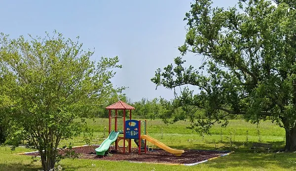 a view of a backyard with green space