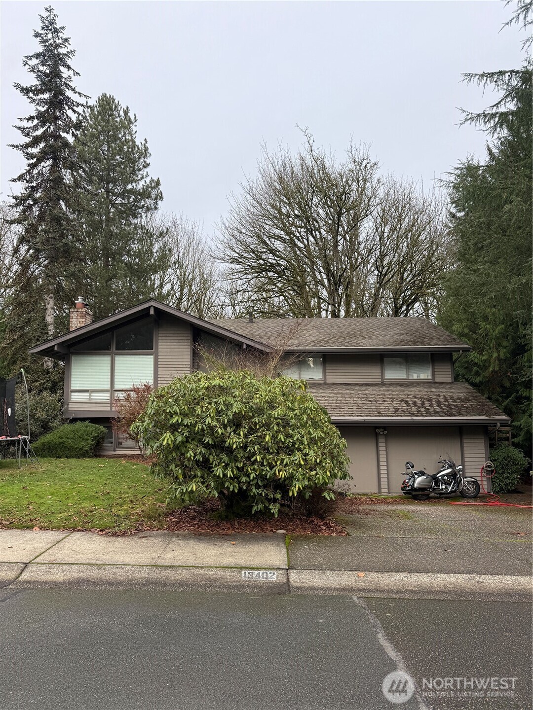 a view of a house with a yard and garage