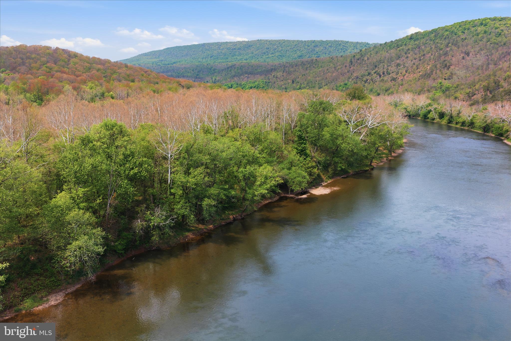 Low Line Road Great Cacapon, WV 25422 - Photo 40 of 53 a view of a lake with a mountain in the background