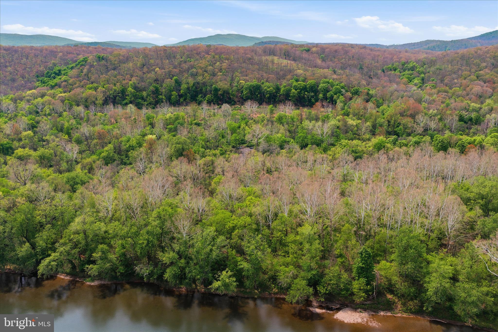 Low Line Road Great Cacapon, WV 25422 - Photo 44 of 53 a view of a lake with mountains in the background