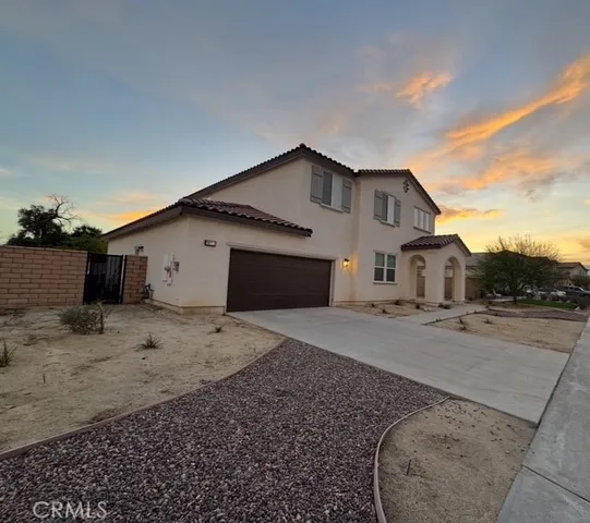 a view of a house with a backyard