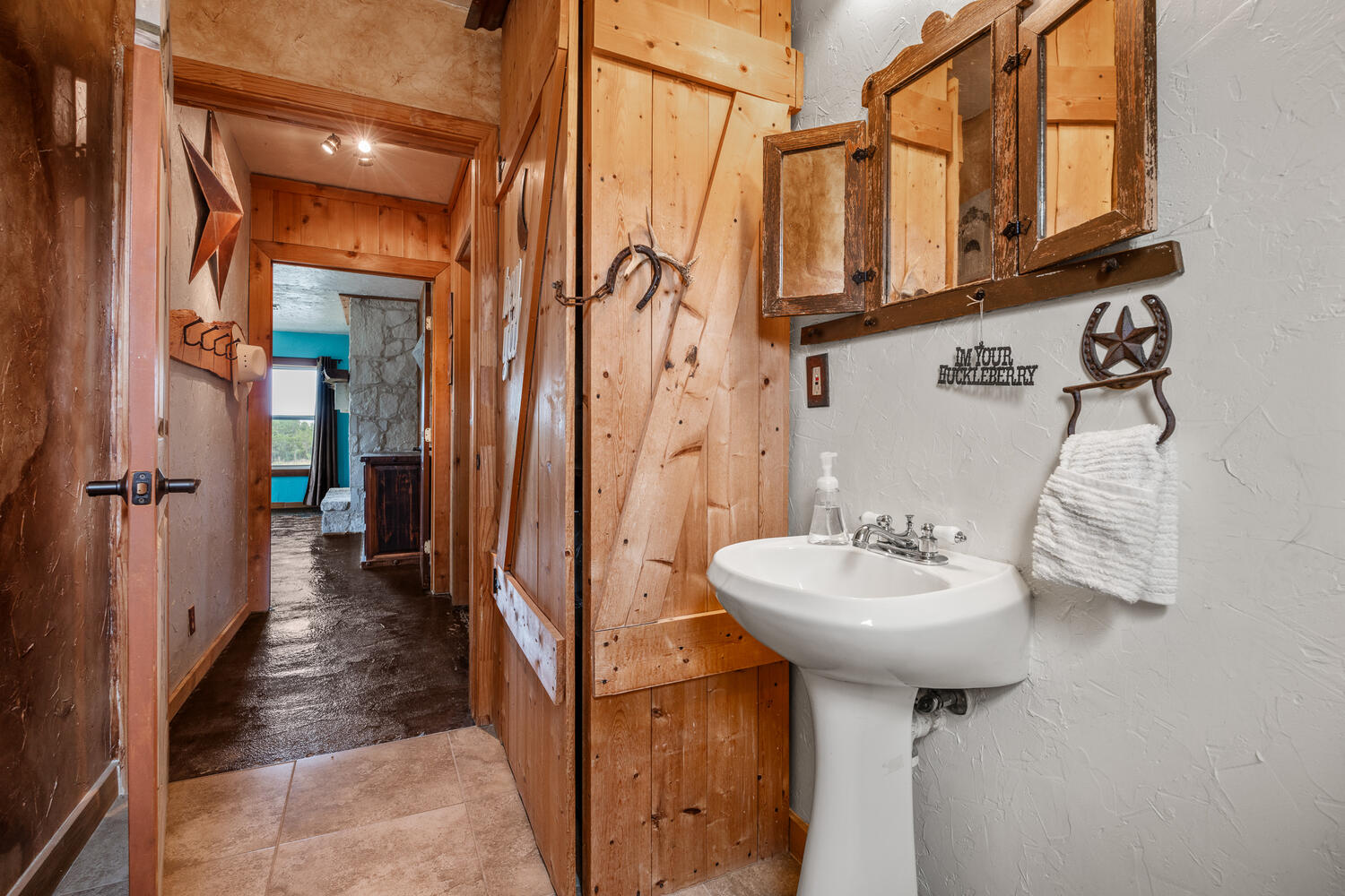 3487 Rust Spring Branch, TX 78070 - Photo 12 of 40 Downstairs half bath with pedestal sink and an ample storage closet.