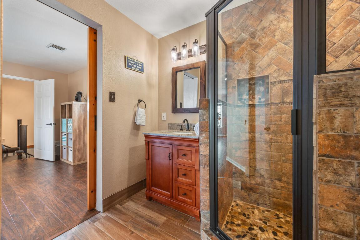 3487 Rust Spring Branch, TX 78070 - Photo 20 of 40 a en suite bathroom with sink shower and mirror
