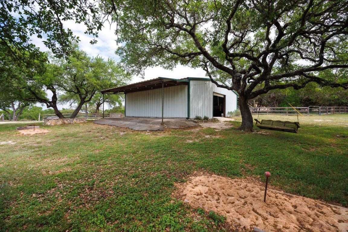 3487 Rust Spring Branch, TX 78070 - Photo 22 of 40 a front view of a house with garden