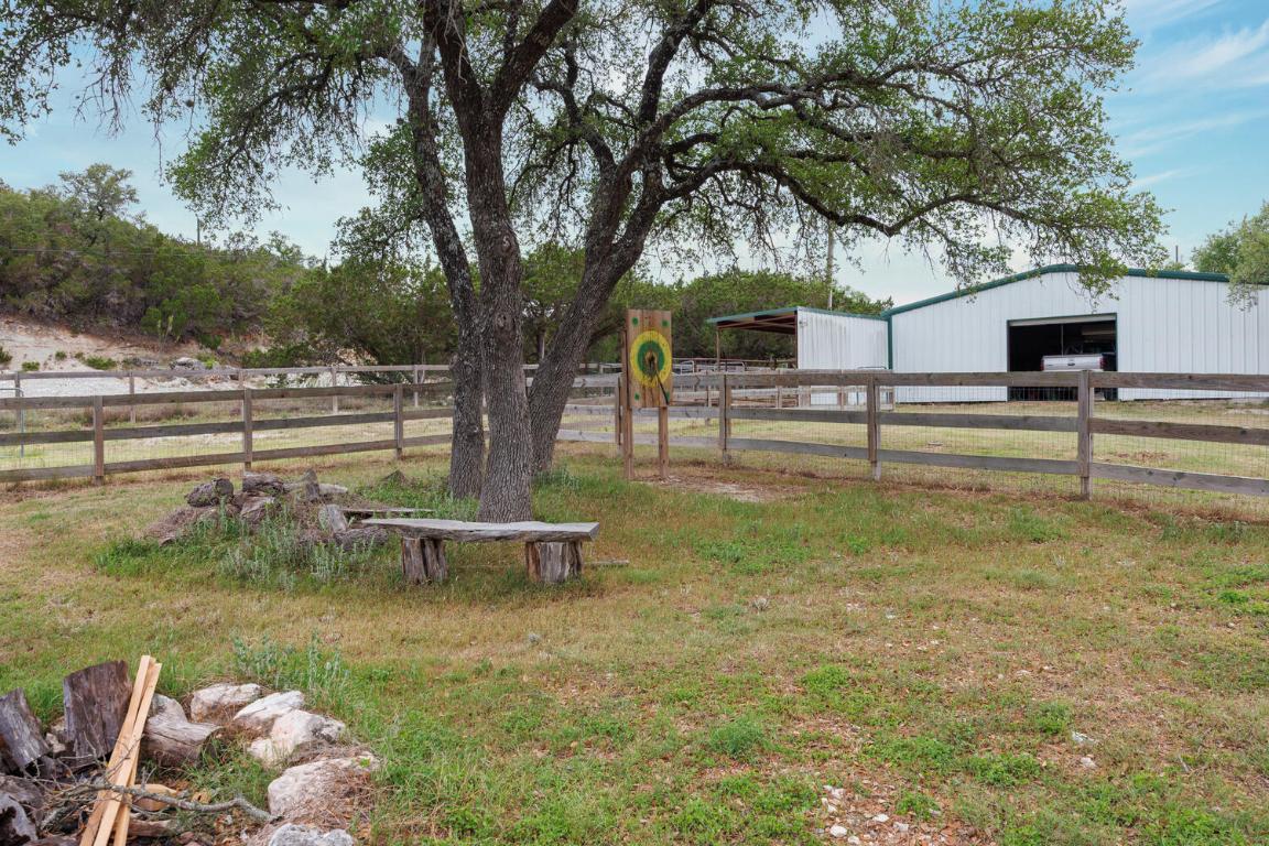 3487 Rust Spring Branch, TX 78070 - Photo 24 of 40 a view of a garden with a tree