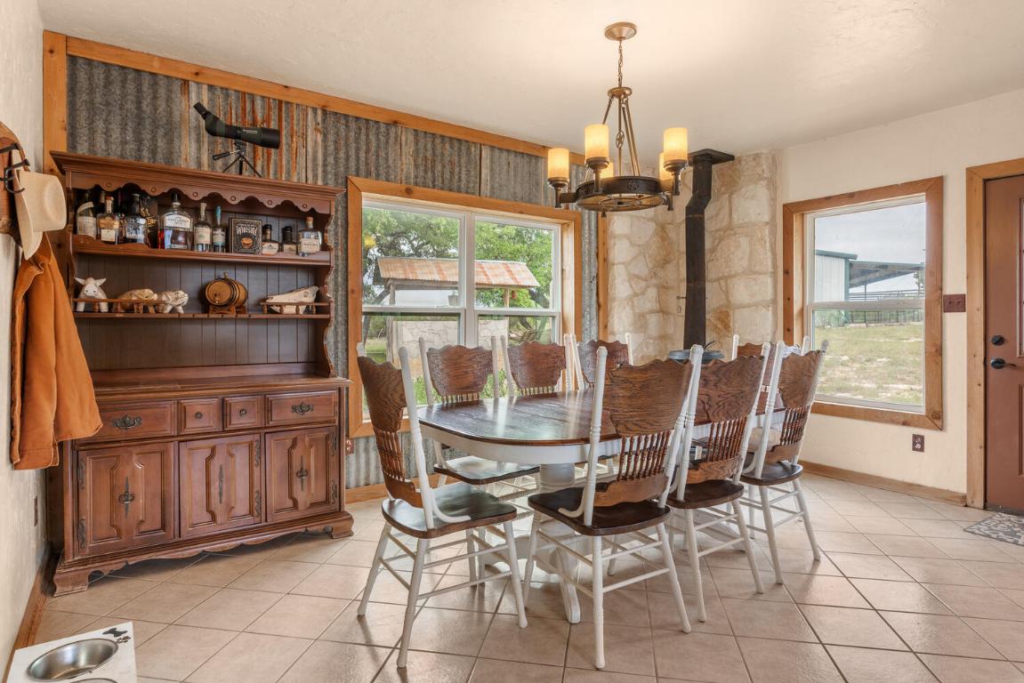 3487 Rust Spring Branch, TX 78070 - Photo 8 of 40 a view of a dining room with furniture window and outside view