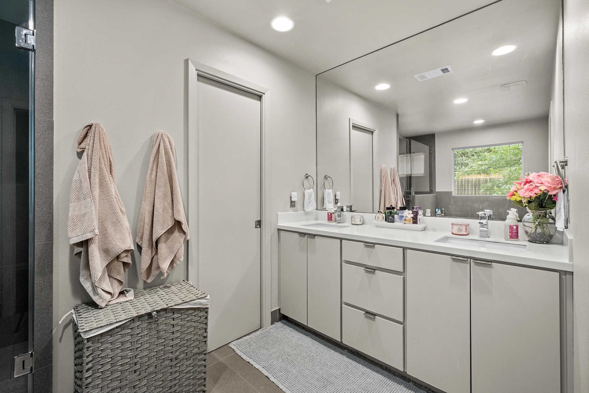 2802 Warren Street, Unit B Austin, TX 78703 - Photo 11 of 23 Dual sink vanity with white countertops and integrated sinks
