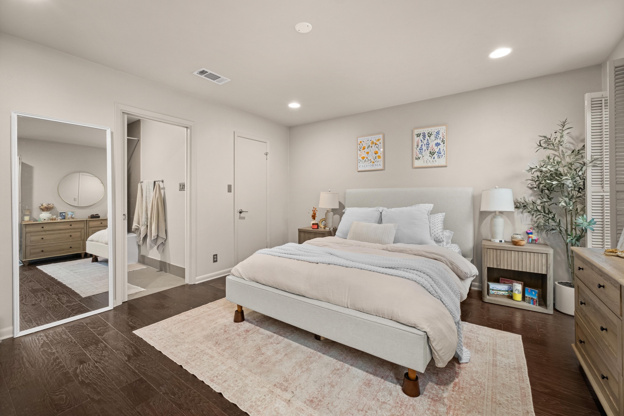 2802 Warren Street, Unit B Austin, TX 78703 - Photo 13 of 23 Bedroom featuring dark wood-finish flooring and light-toned walls